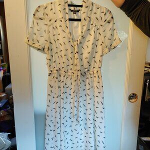 Short-sleeved, lightweight, white and black patterned women's dress.